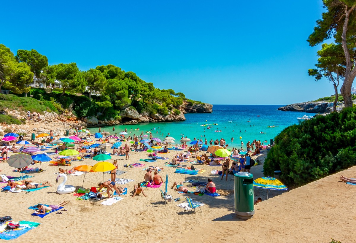 People on Esmeralda beach in Cala D'Or, Mallorca, Spain
